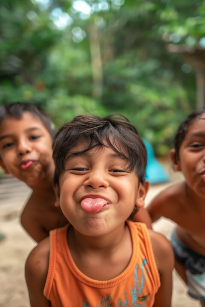 Hawaiian Children Making Funny Faces and Sticking Out Tongues Stock Free