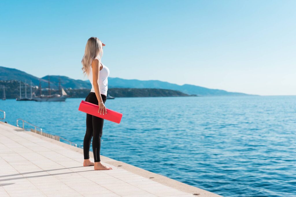 Healthy Woman Preparing for her Morning Yoga Stretching Workout Free Photo