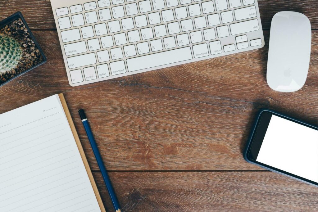 High angle view of a setting table computer, phone, tablet of business workplace. Stock Free