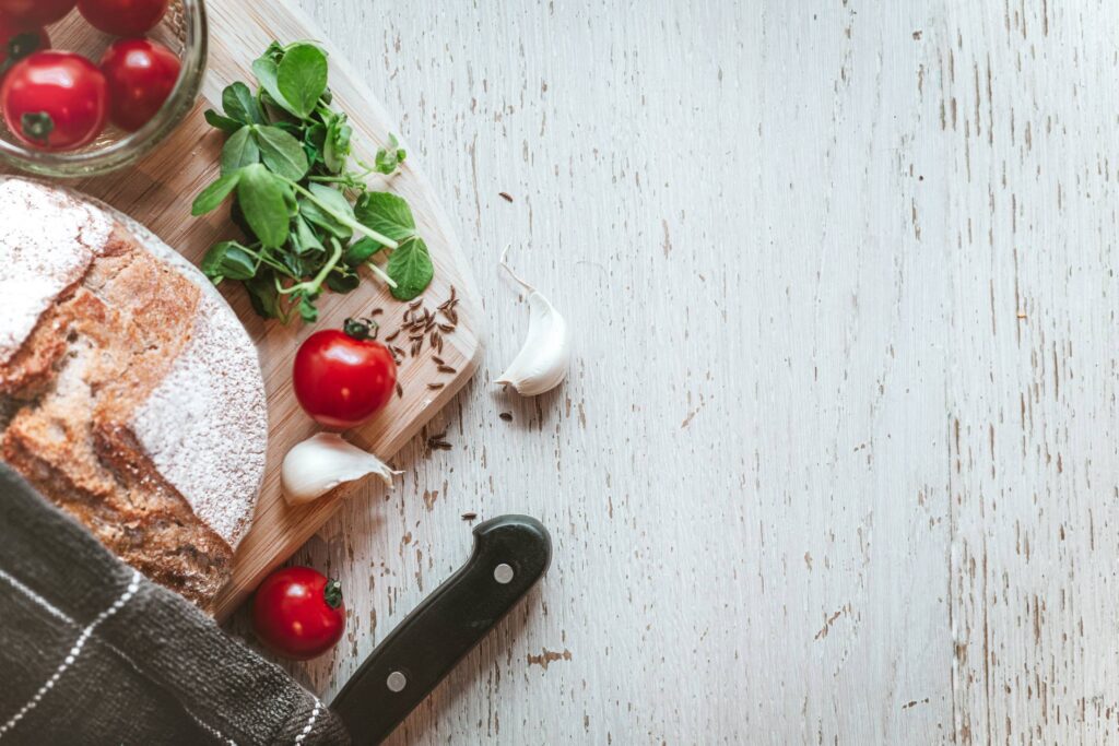 Homemade Bread with Wooden Background Texture Space for Text Free Photo