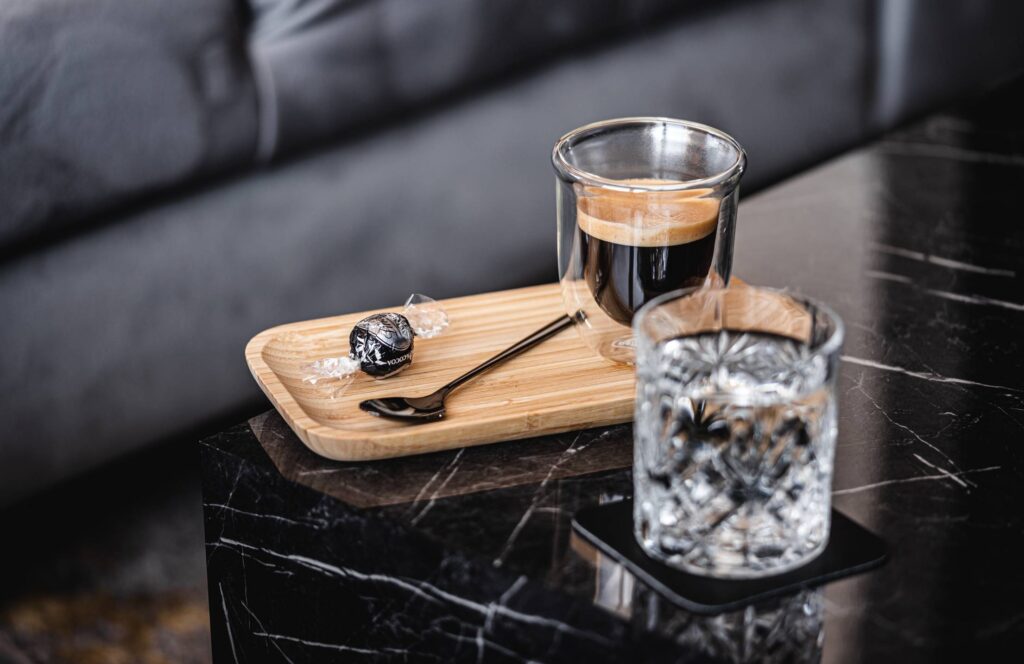 Homemade Lungo Cafe on a Marble Table Free Photo