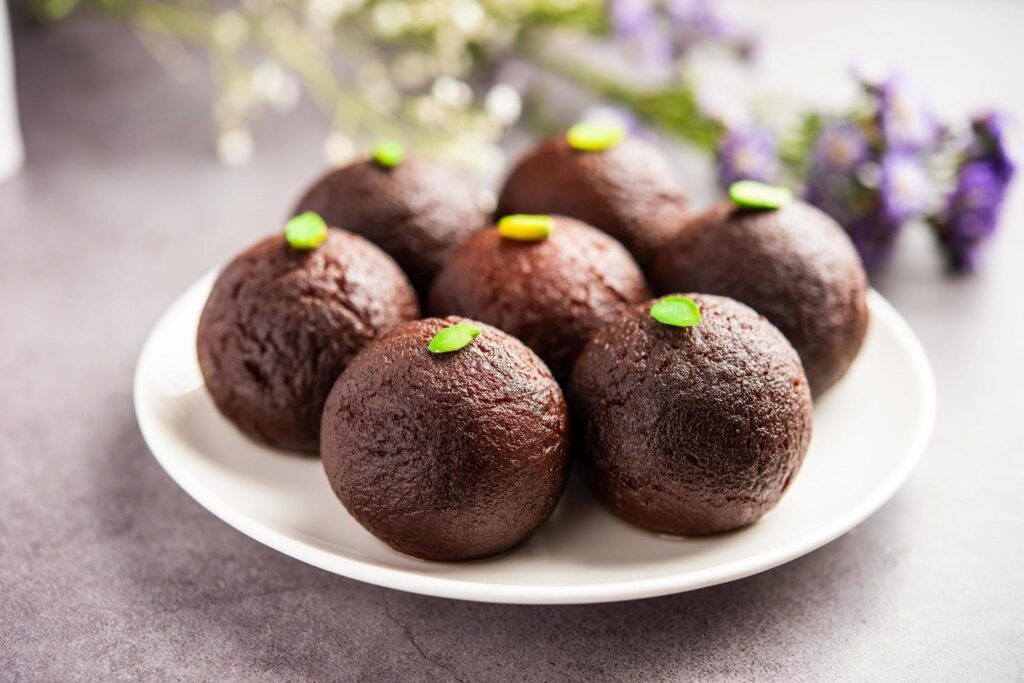 Indian Sweet Food Sweet Black Gulab Jamun Also Known as Kala Jamun, Black Jamun or Dry Kala Jam Stock Free