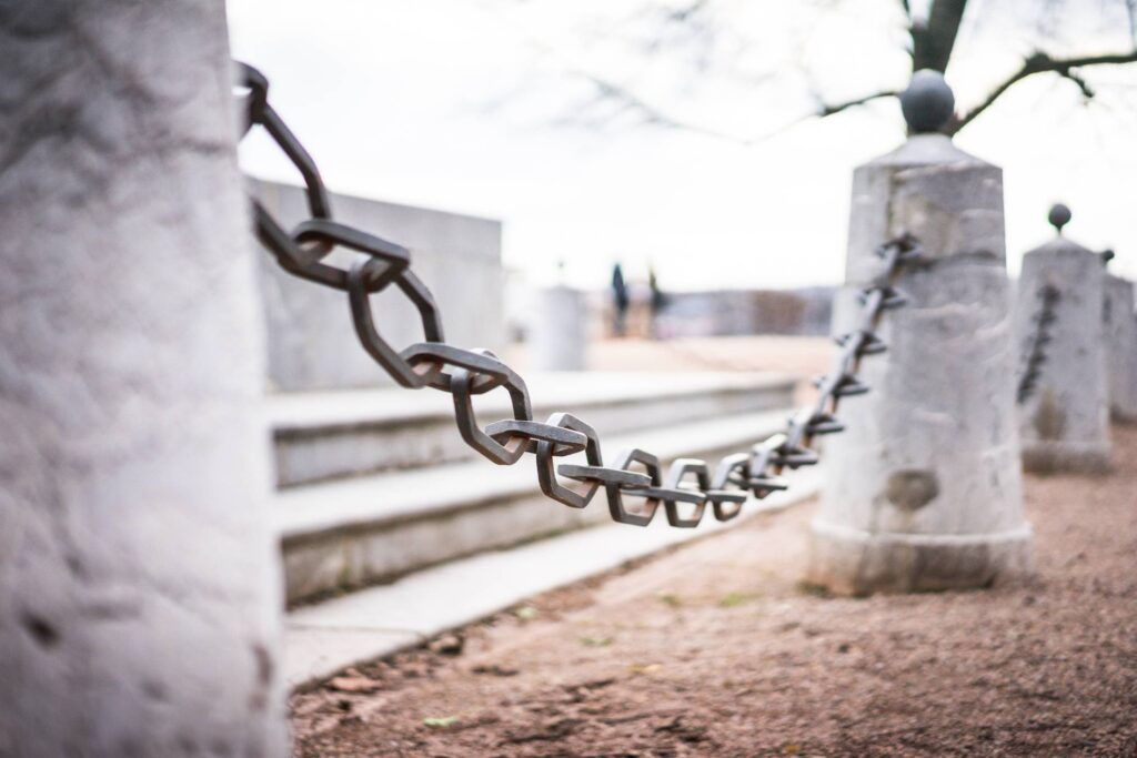 Iron Chain Around Historic Monument Free Photo