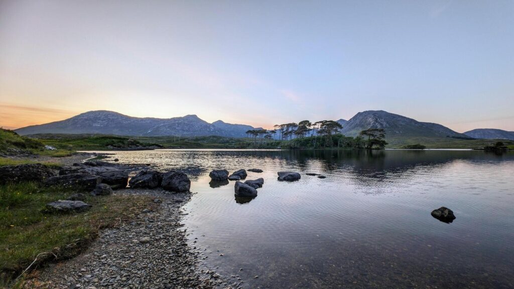 Lakeside landscape sunset scenery of Twelve pines island, Derryclare lake at Connemara, Galway Ireland, nature background Stock Free