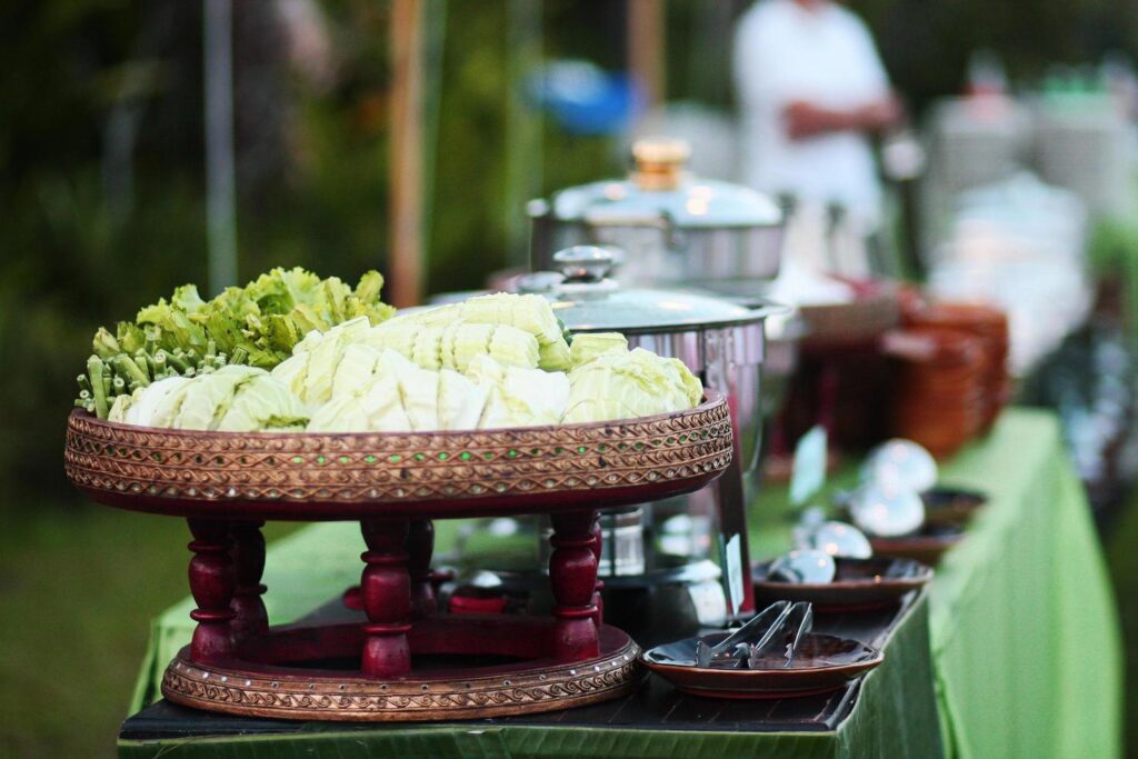 Lanna thai cuisine buffet set delicious food with vegetables on rattan basket Stock Free