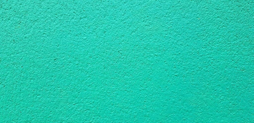 Light green painted Rough or grunge concrete or cement wall for background. Retro wallpaper, Colorful, Painting and Texture of surface concept Stock Free