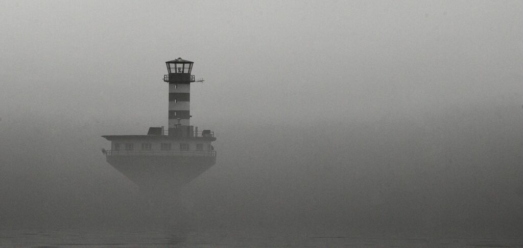 Lighthouse in the mist Stock Free