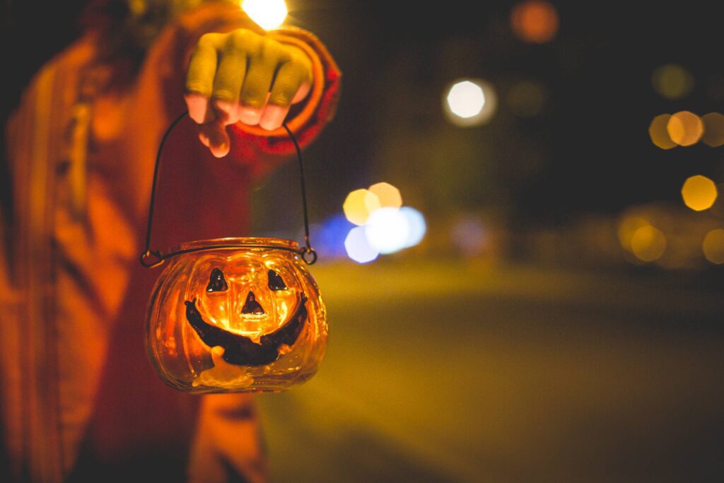 Little Girl Holding Halloween Candle Holder Free Photo