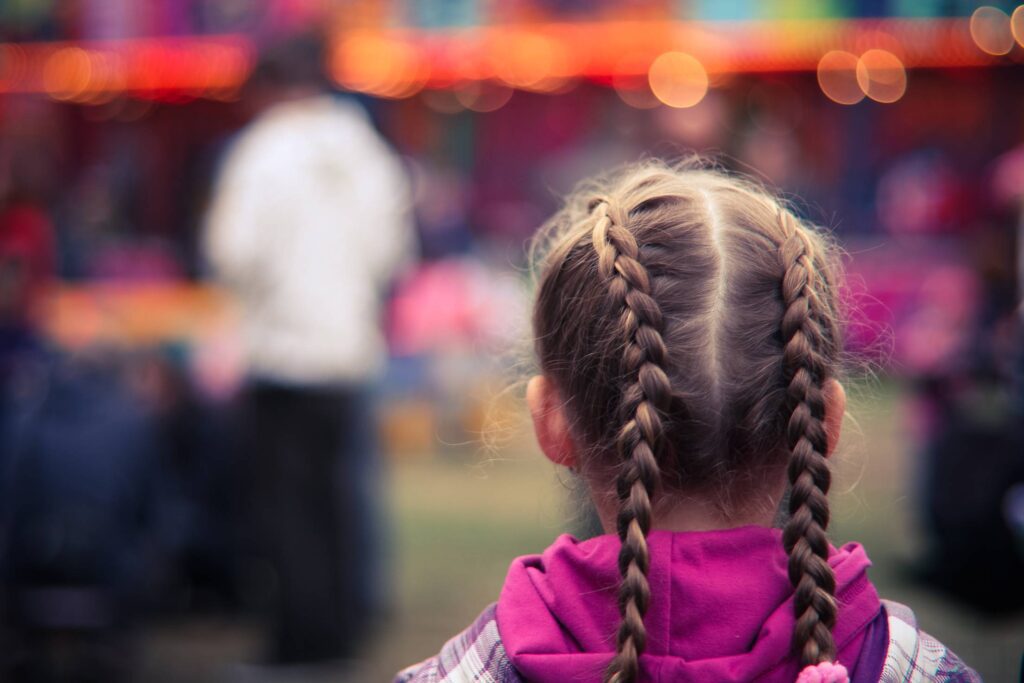 Little Girl in Amusement Park Free Photo