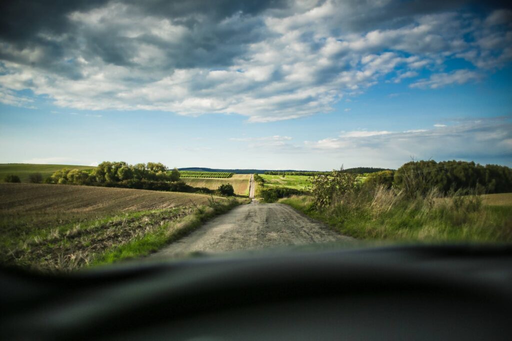 Lonely Road In The Middle Of Fields Free Photo