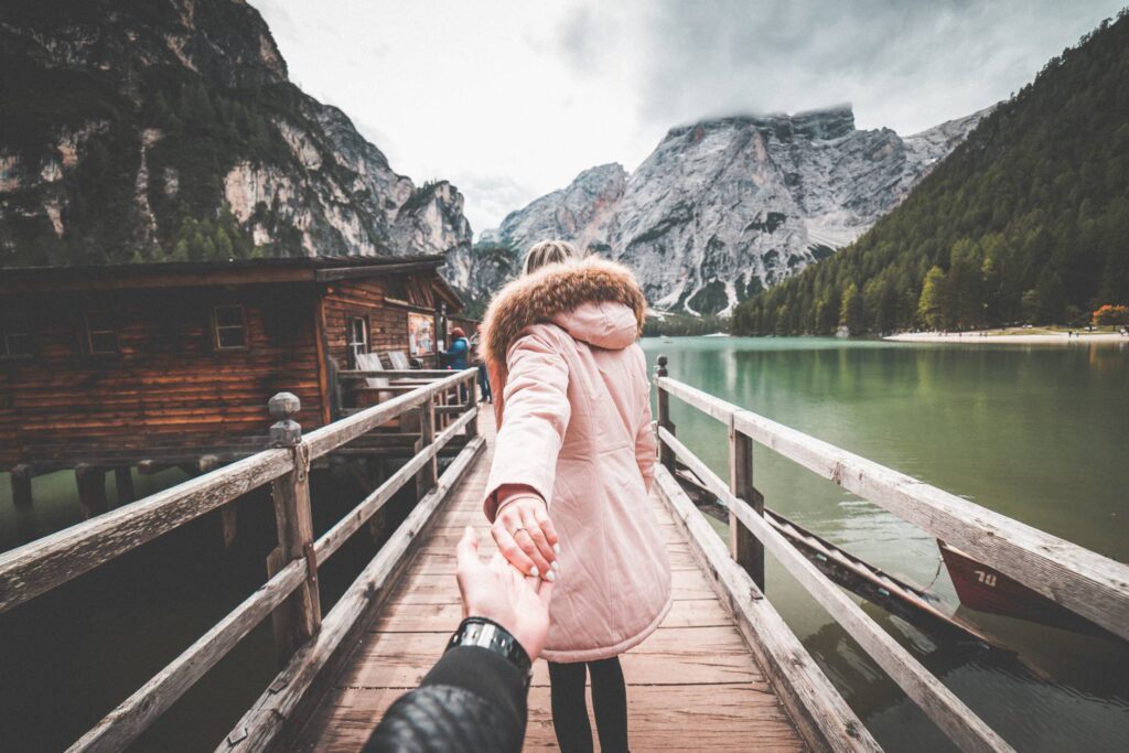 Lovely Couple in Follow Me To Pose on Braies Lake Pier, Italy Free Photo