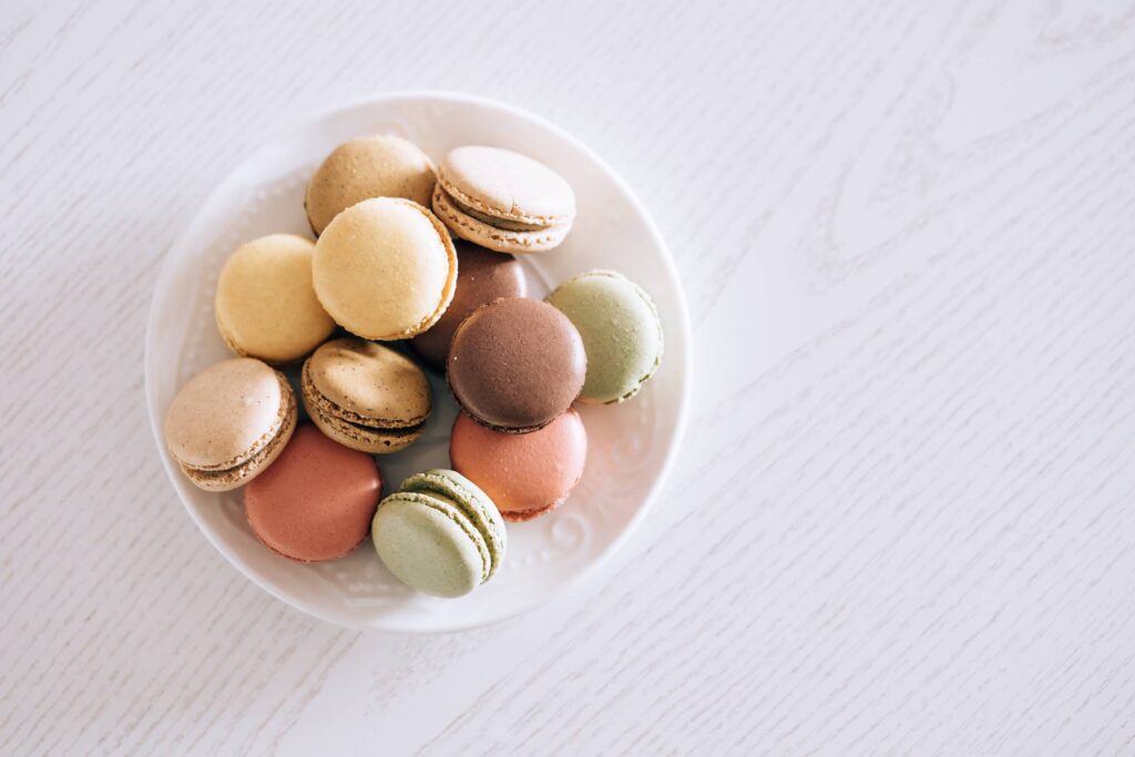 Macarons in Pastel Colors on The White Wood Free Photo