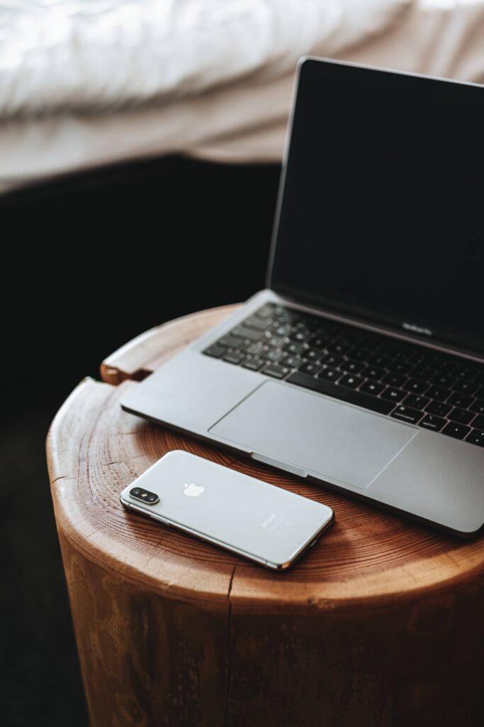 MacBook and iPhone XS on Wooden Table Free Photo