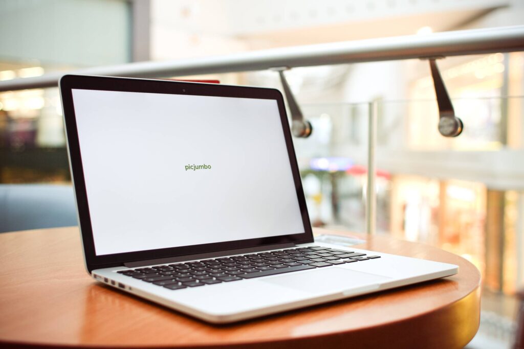 MacBook Laptop in Café Free Photo