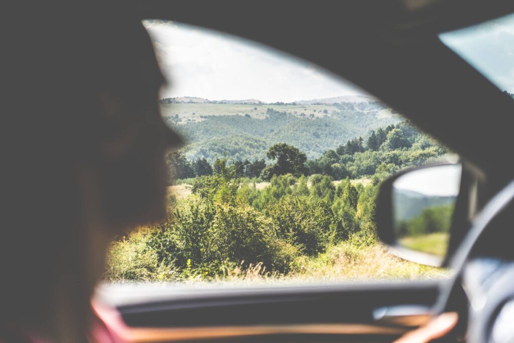 Man Driving a Car in Countryside Free Photo