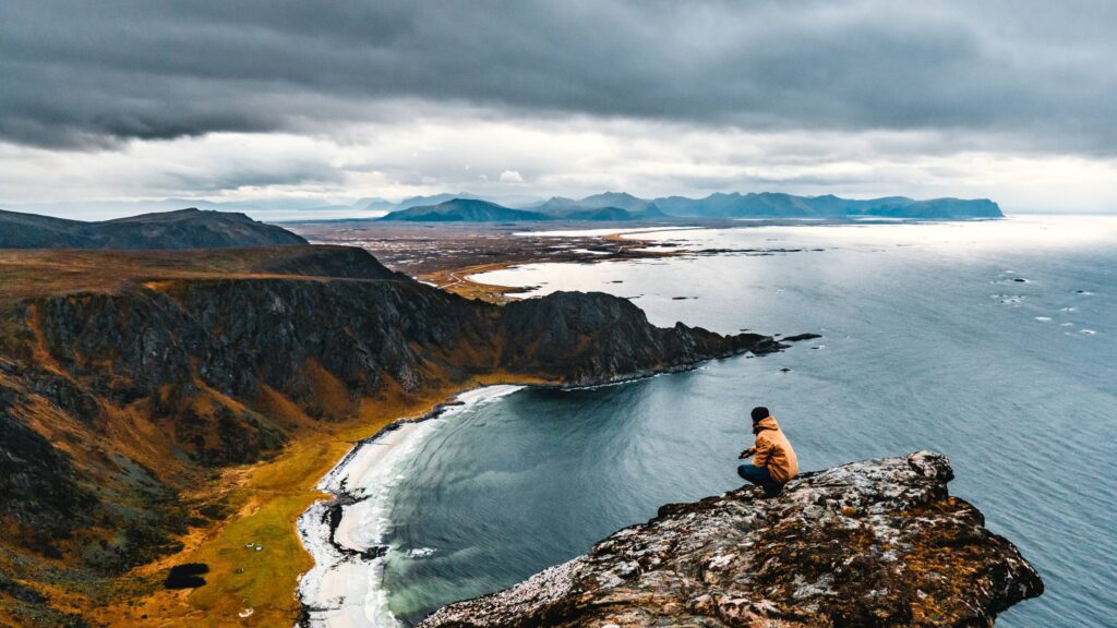 Man Enjoying a Moody View to the Norwegian Landscape Free Photo