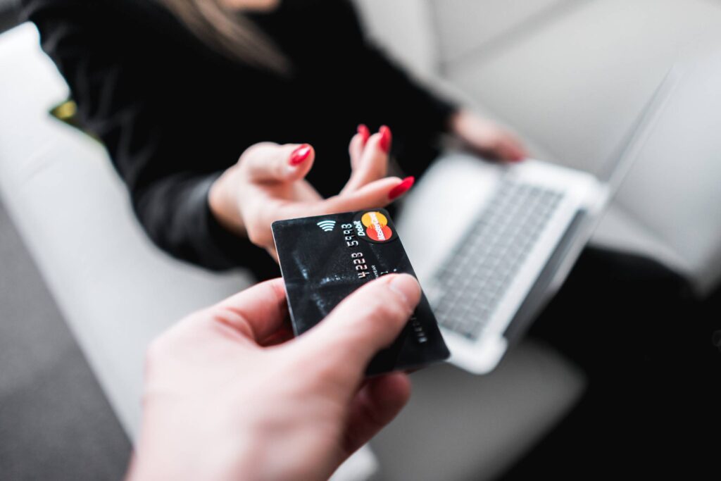 Man Giving His Credit Card to a Woman Free Photo