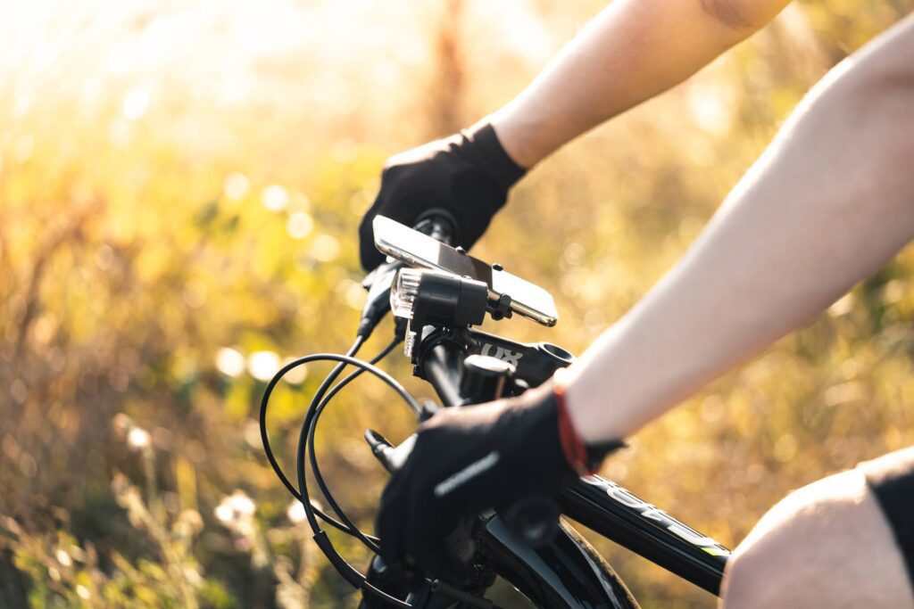 Man Holding a Bicycle Handlebar Free Photo