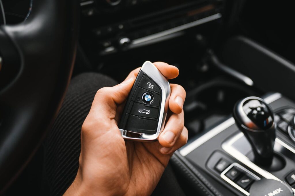 Man Holding a BMW M Sport Car Key Free Photo