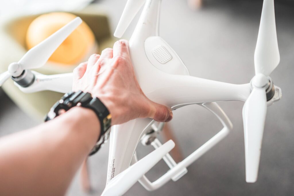 Man Holding a Drone in Hands Free Photo