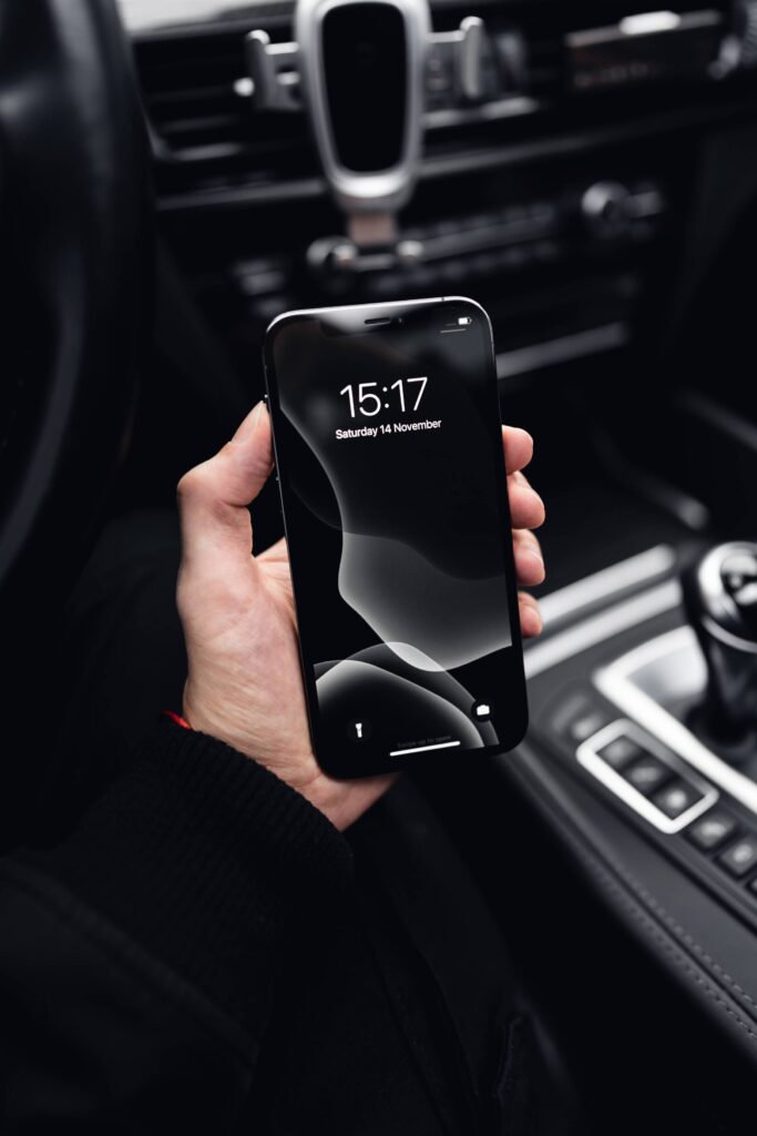 Man Holding a New Smartphone in a Hand Free Photo