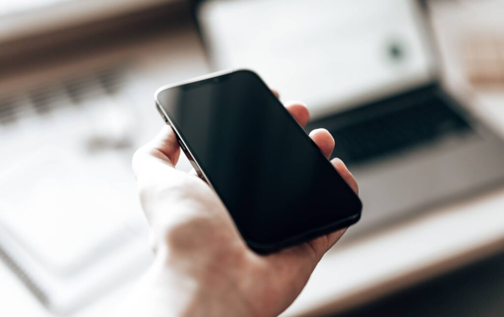 Man Holding a Smartphone Free Photo