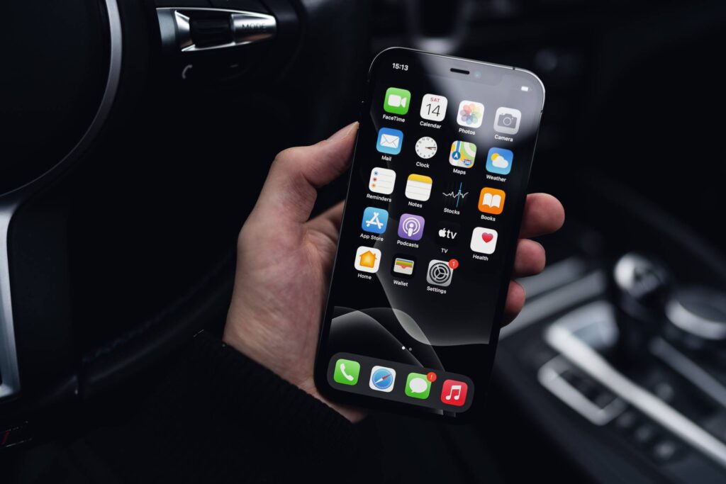 Man Holding a Smartphone in a Car Free Photo