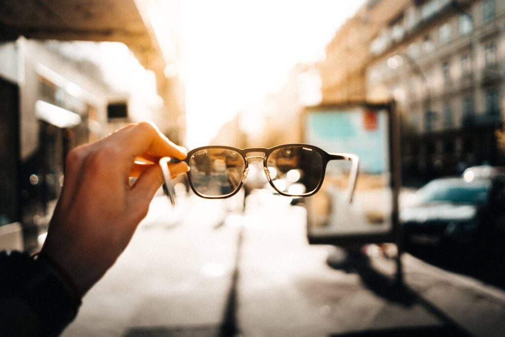 Man Holding Sunglasses Free Photo