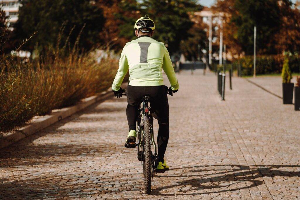 Man on a Bike in Fall Free Photo