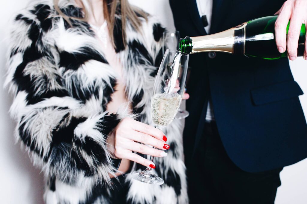 Man Pouring Glass of Champagne Free Photo