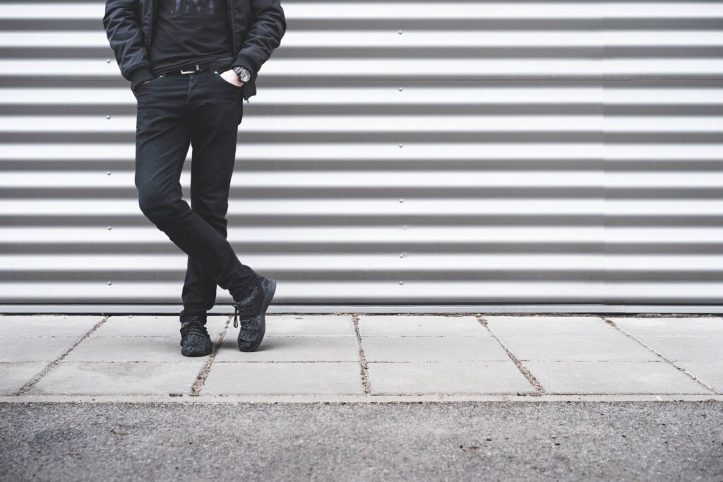 Man Standing in Front of Metallic Wall Free Photo