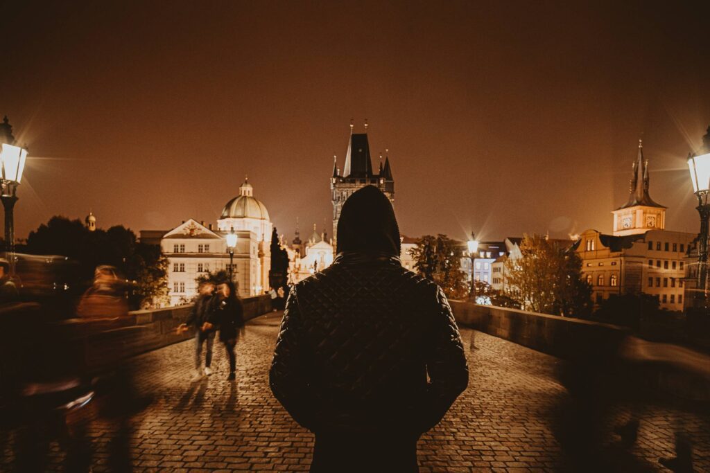 Man Standing on Charles Bridge in Prague Free Photo