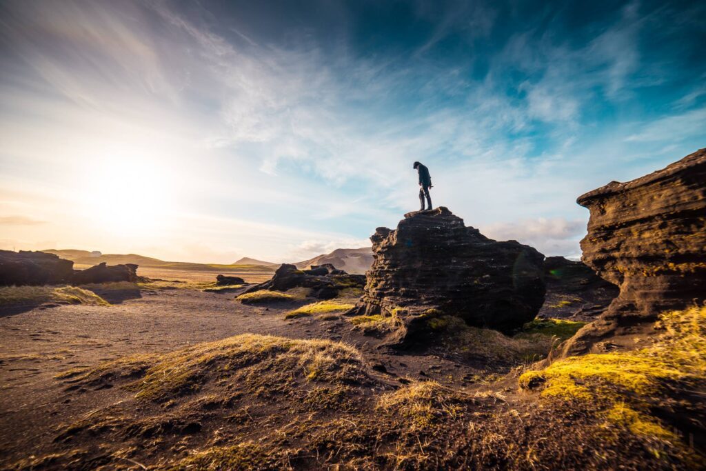 Man Standing on The Rock Free Photo