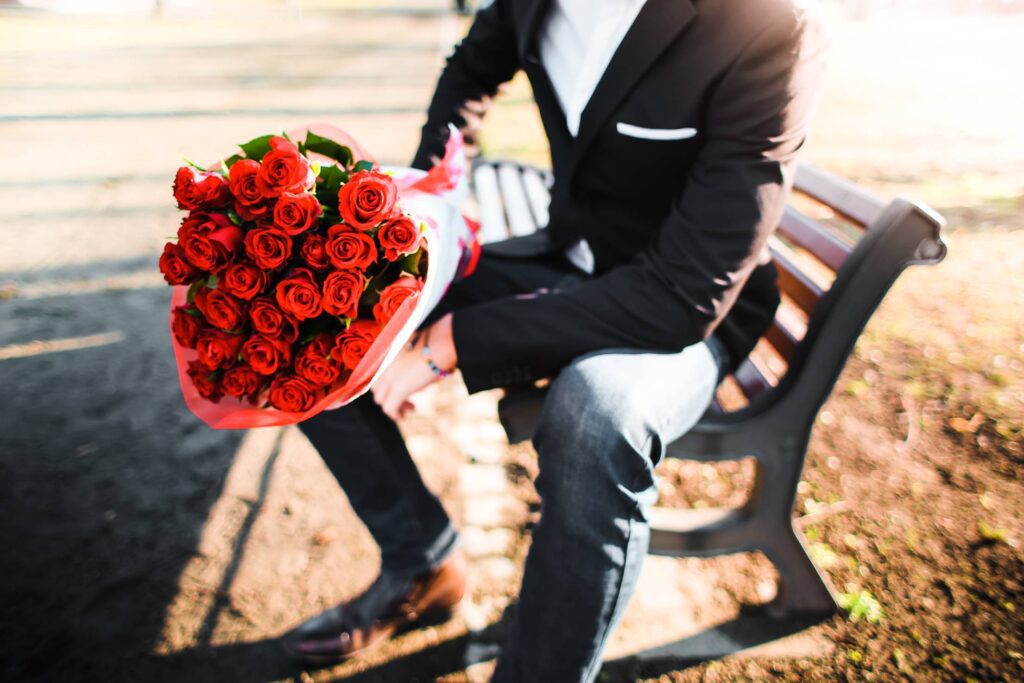 Man with a Bouquet of Roses Free Photo