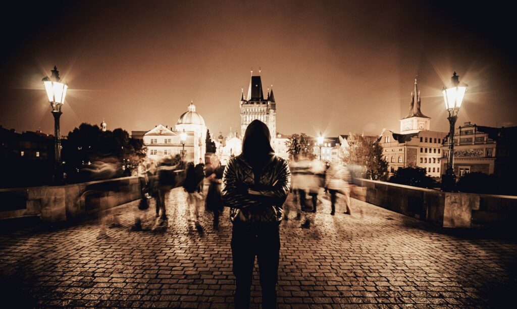 Man with Crossed Arms on Charles Bridge in Prague Free Photo