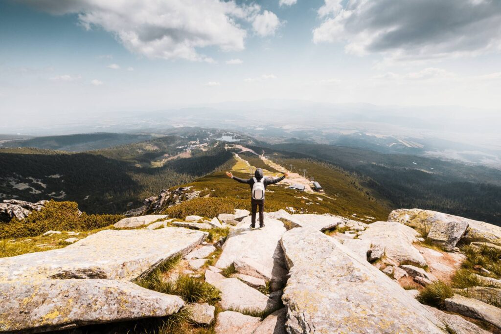 Man with Open Arms Saluting the Nature Free Photo