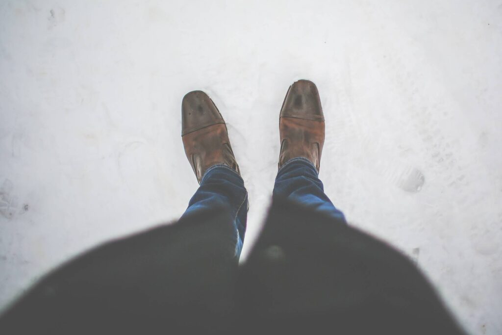 Men Leather Shoes in Snow Free Photo