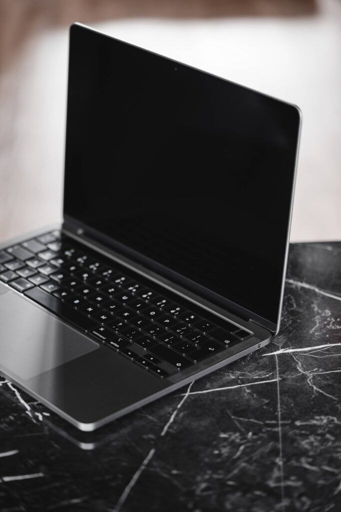 Modern Laptop on a Luxury Marble Table Free Photo