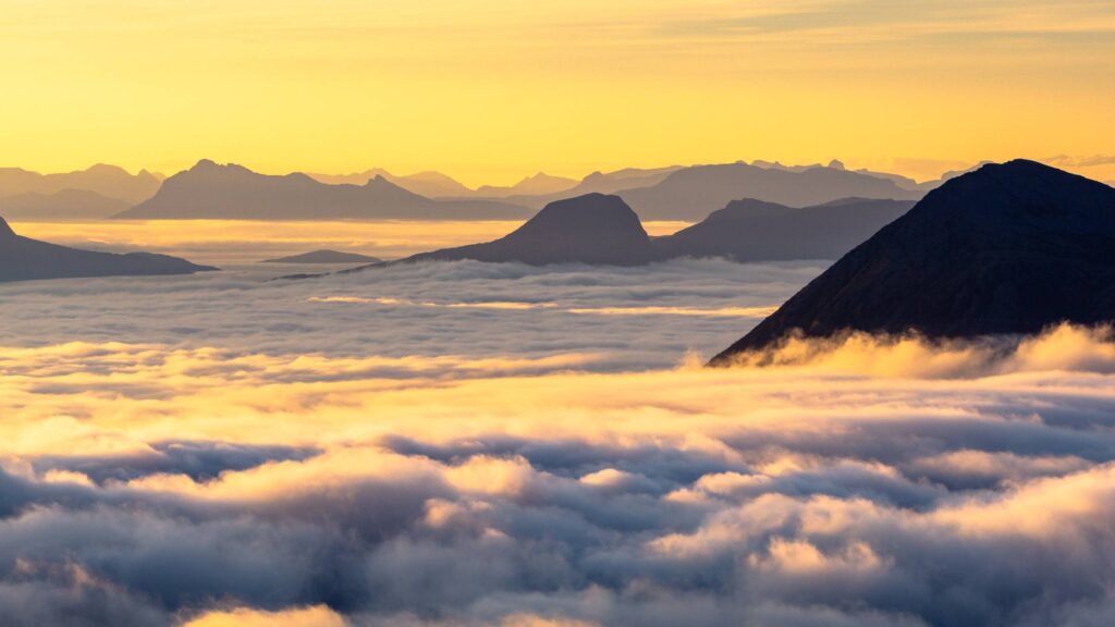 Mountains Sticking out of Inverse in a Beautiful Sunrise Light Free Photo