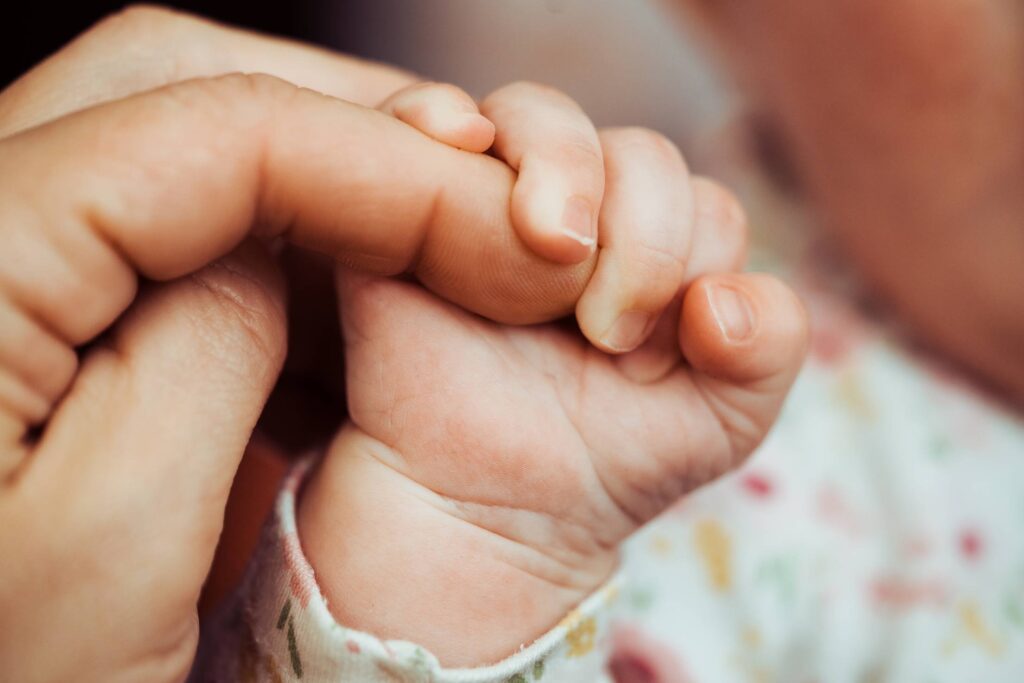 Newborn Baby Holding Adult Finger Free Photo