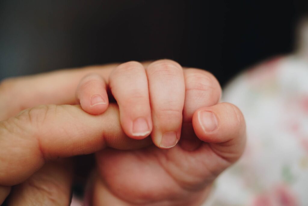 Newborn Baby Holding Parent’s One Hand Free Photo