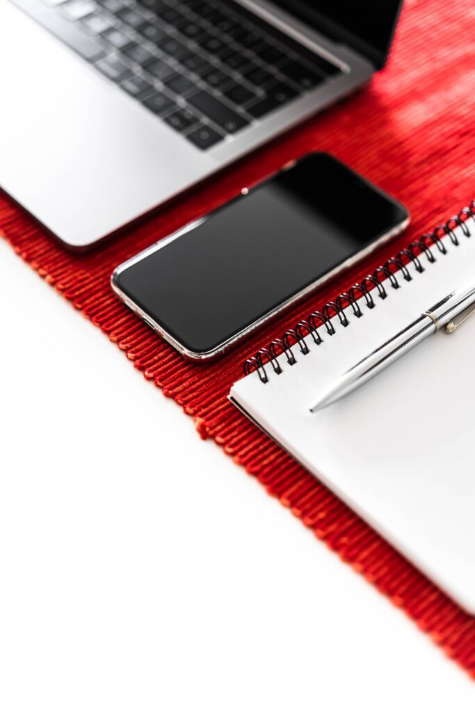 Office Essentials: Smartphone, Laptop and Diary Free Photo