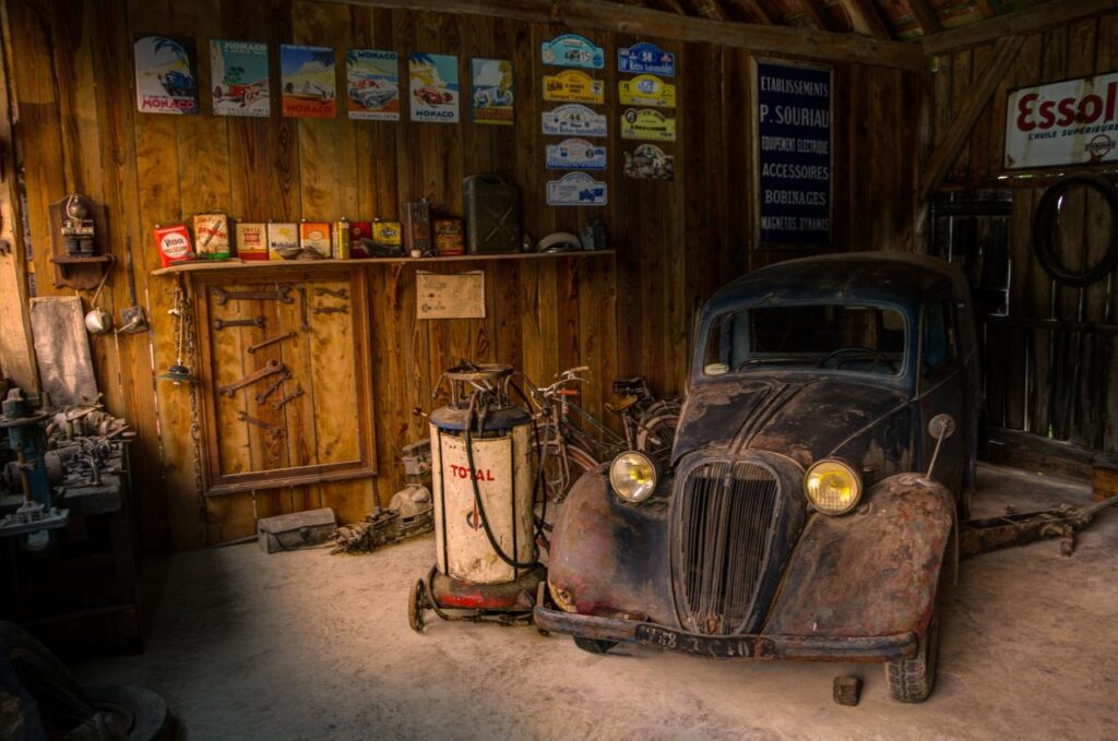 Old car in repair shop Stock Free