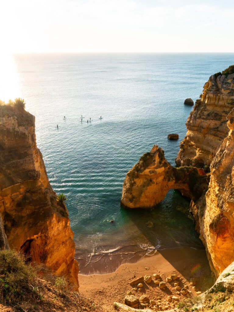 Paddleboarding Between Sea Pillars of Southern Portugal Free Photo