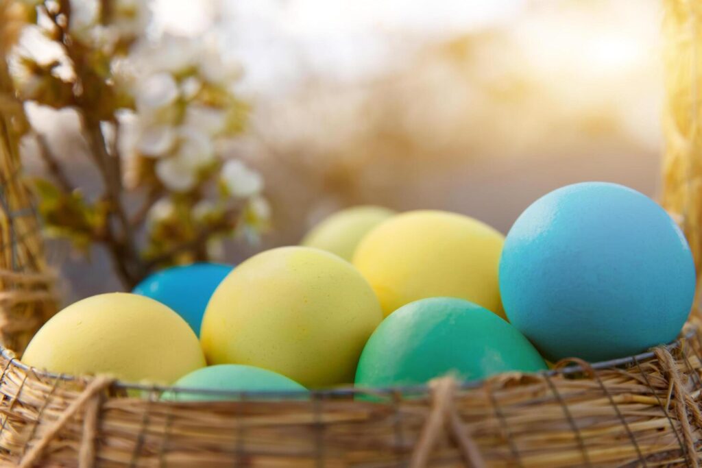 Paint eggs for Easter, bright Easter holiday, children paint eggs, colored eggs in a basket, colored eggs on a stand, Holiday background Stock Free