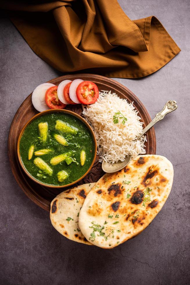 palak baby corn sabzi also known as spinach makai curry served with rice or roti, Indian food Stock Free