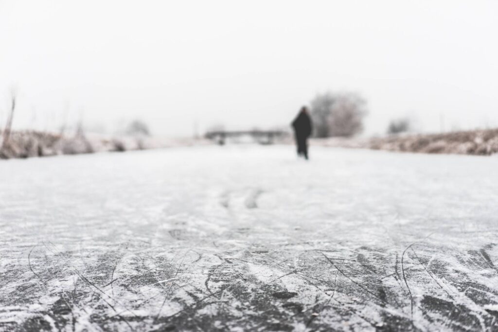 People Ice Skate on a Frozen River Free Photo