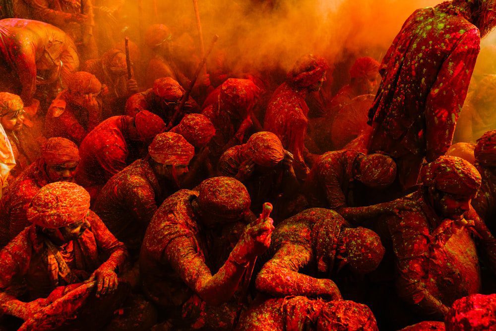 a group of people covered in colored powder