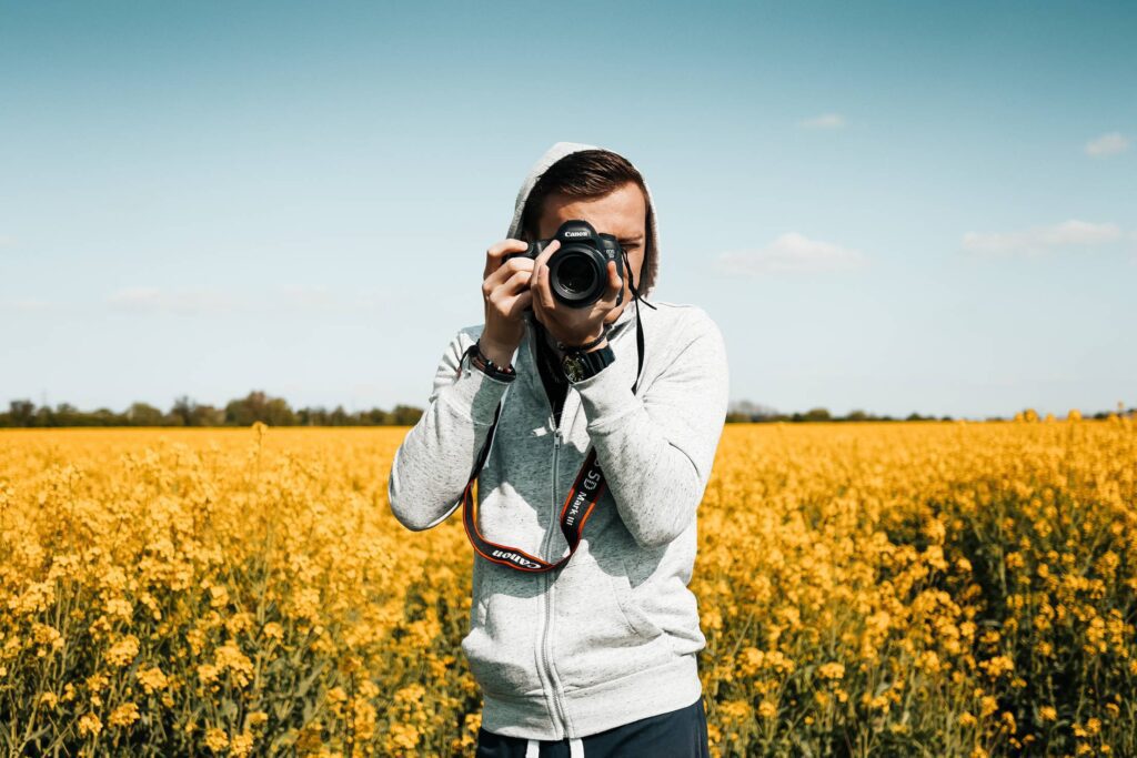 Photographer Taking a Photo in The Field Free Photo