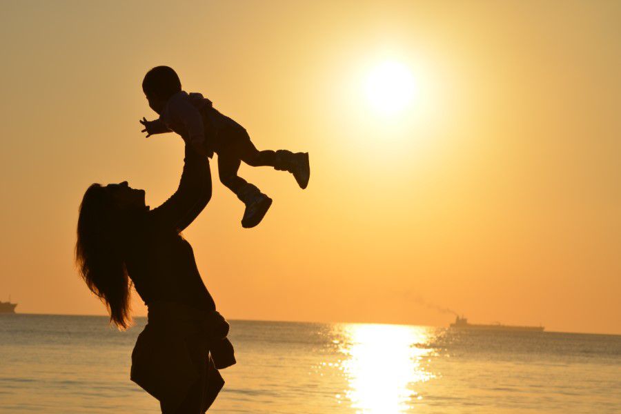 Baby & Mother at Beach Free Stock HD Photo